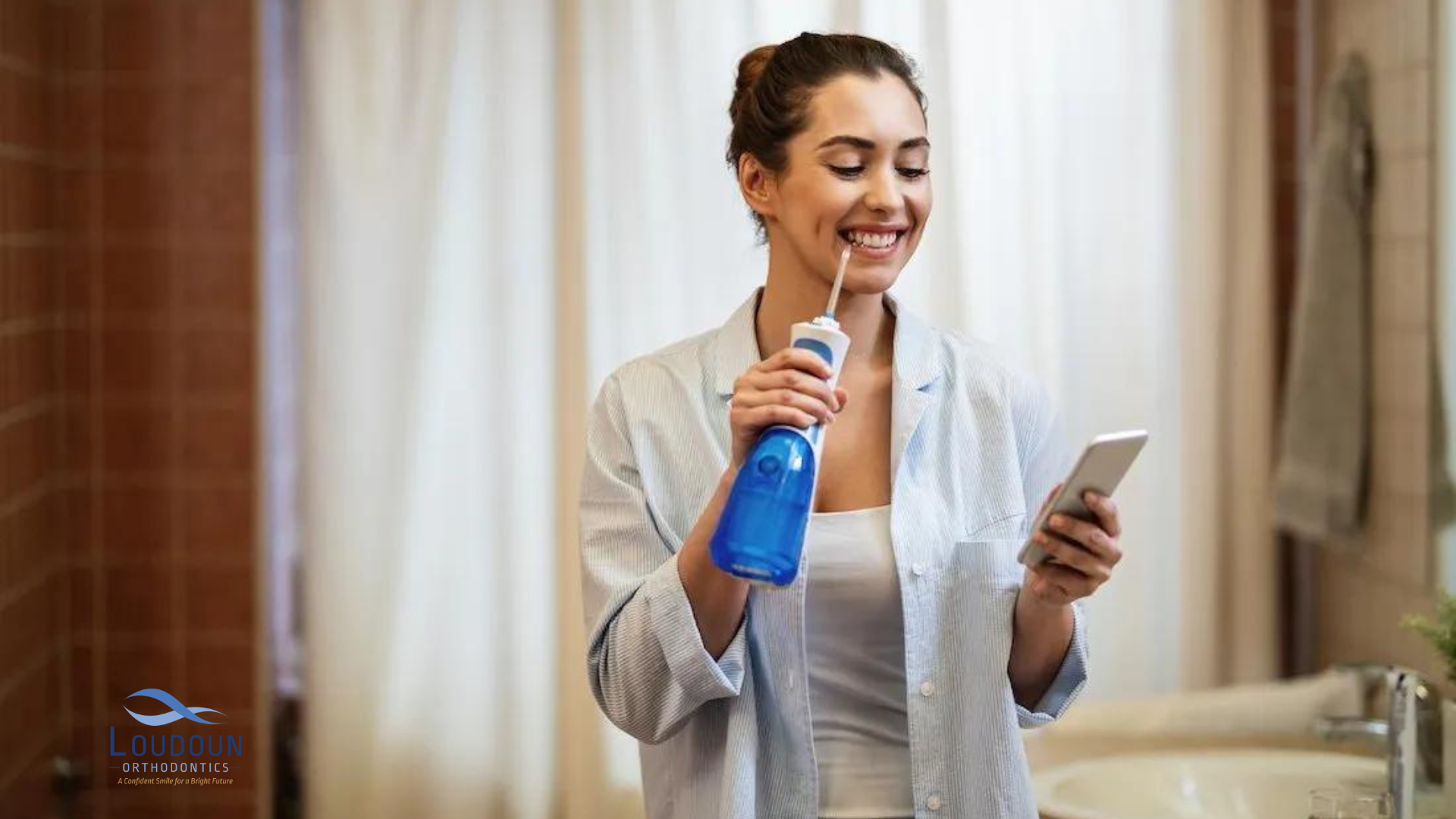 Woman holding a water flosser