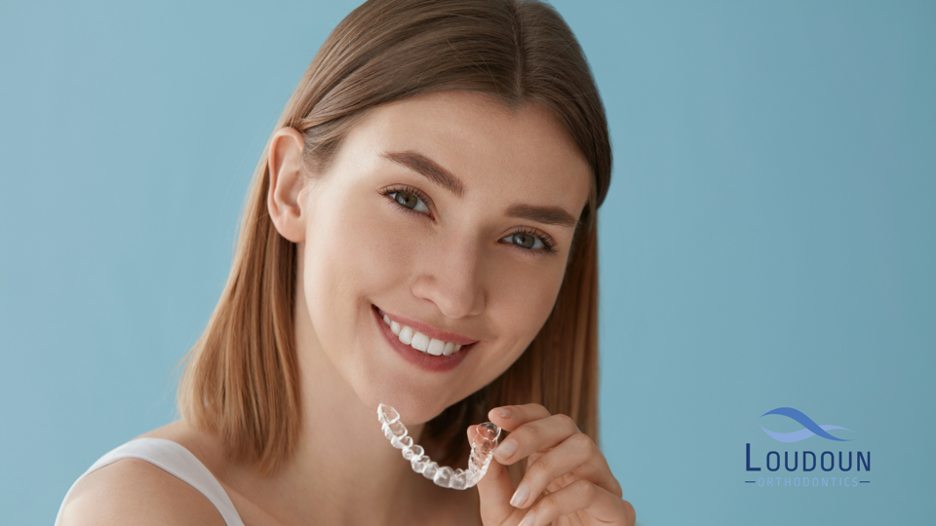 Woman holding clear retainer