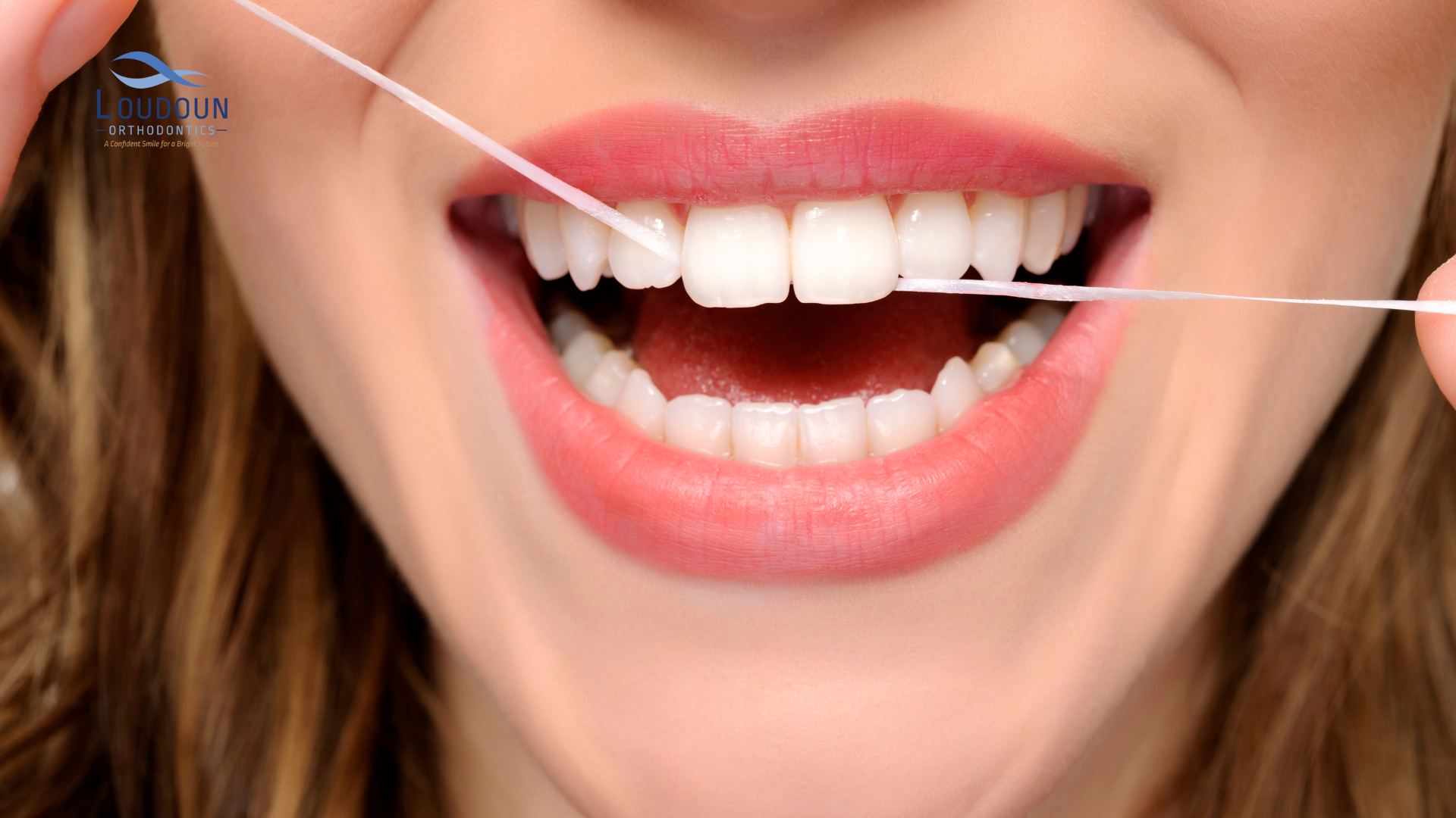 Woman flossing with thread