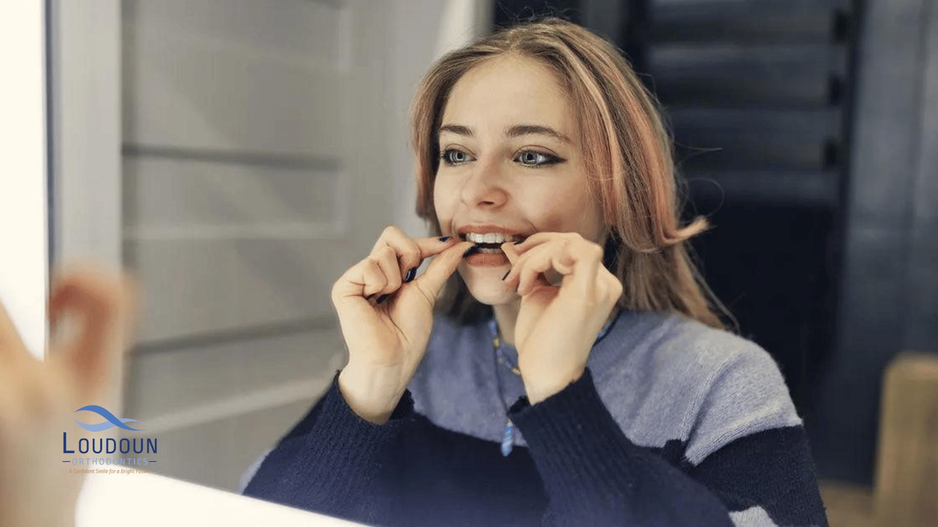 Woman putting on angel aligner